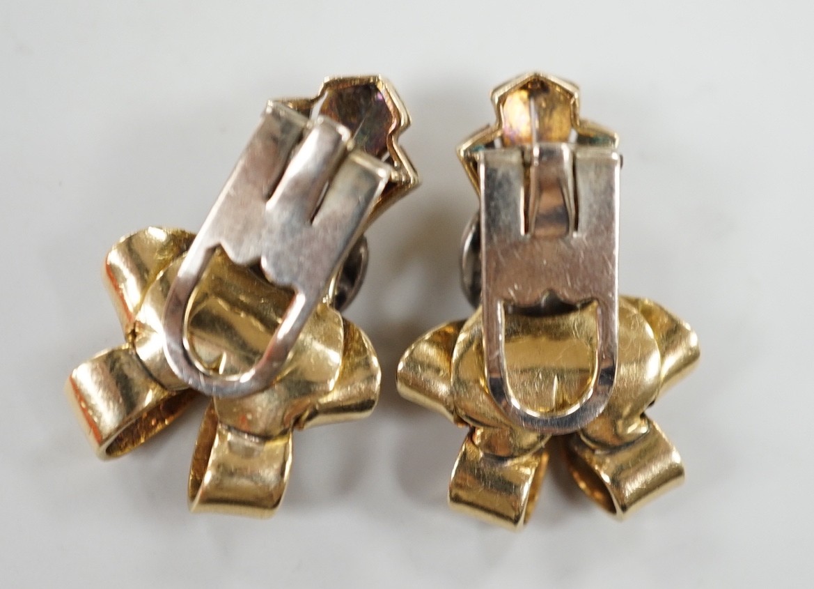 A pair of mid 20th century yellow and white metal, diamond cluster set scroll ear clips, 27mm, gross weight 13.5 grams.